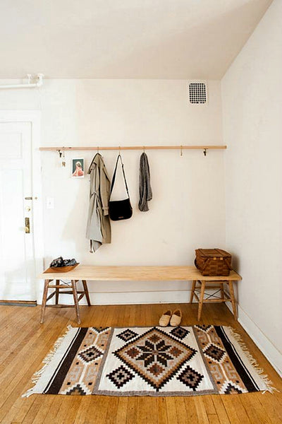 When you have guests, what is the first thing they see when they walk through your front door? Is there a place to hang their coat? How about a spot to plop a purse?